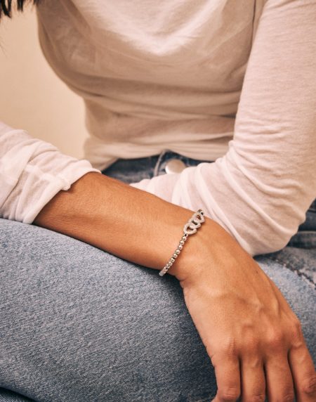 Pulsera fina cordón y adorno cadena plata